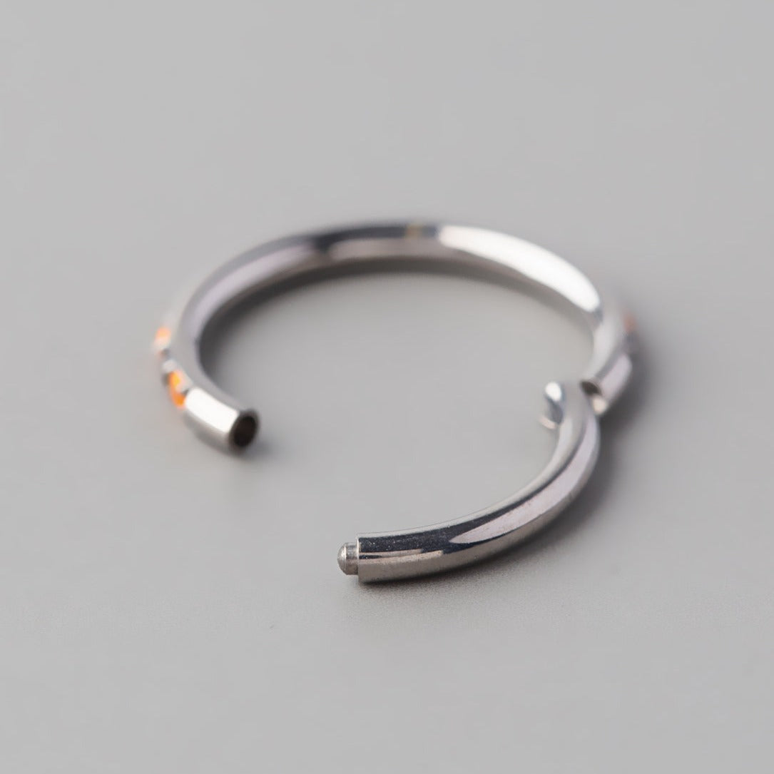 Hinged Segment Ring Orange Opal & Black CZ Side Face in Silver - Titanium - Camden Body Jewellery