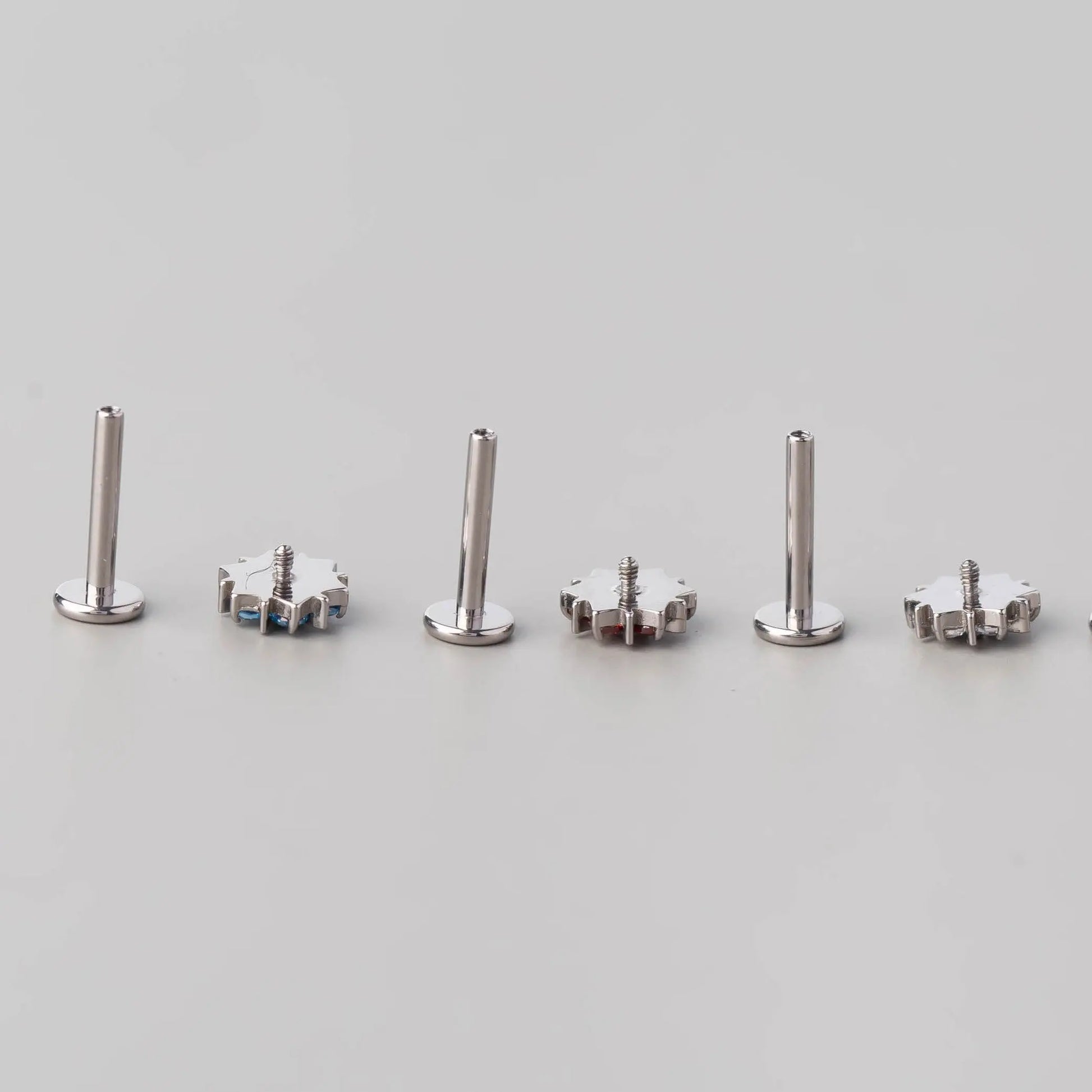 CZ Paved Flower Labret in Red - Titanium - Camden Body Jewellery