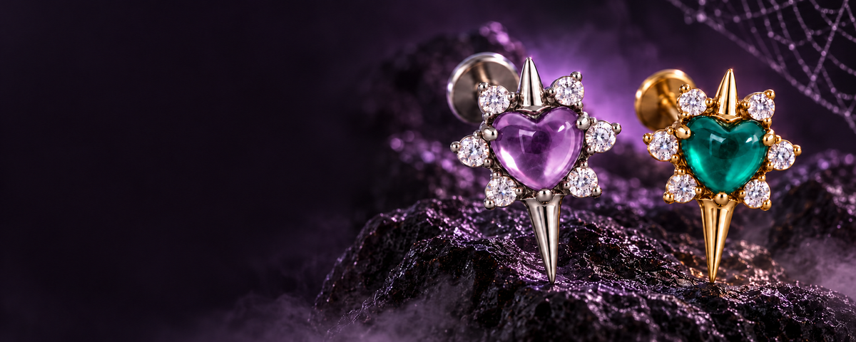 Amethyst and green onyx heart-centred star jewellery on a dark purple Halloween backdrop
